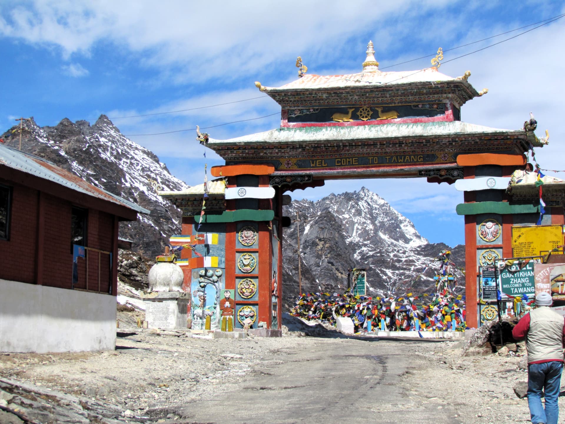 The welcome gate to Tawang below snow-dusted Himalayan peaks